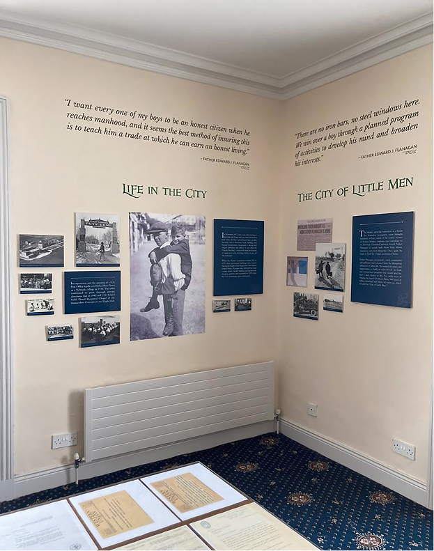 Father Flanagan Visitor Centre interior: two walls of exhibits.